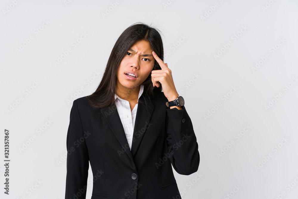 Young asian business woman showing a disappointment gesture with forefinger. Young asian business woman showing a disappointment gesture with forefinger.