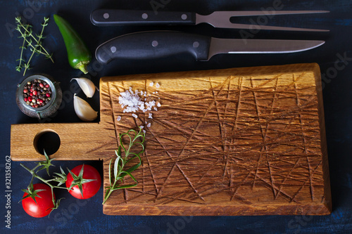 Cutting board and seasoning. Background for meat, fish, food. Flat lay, copy space