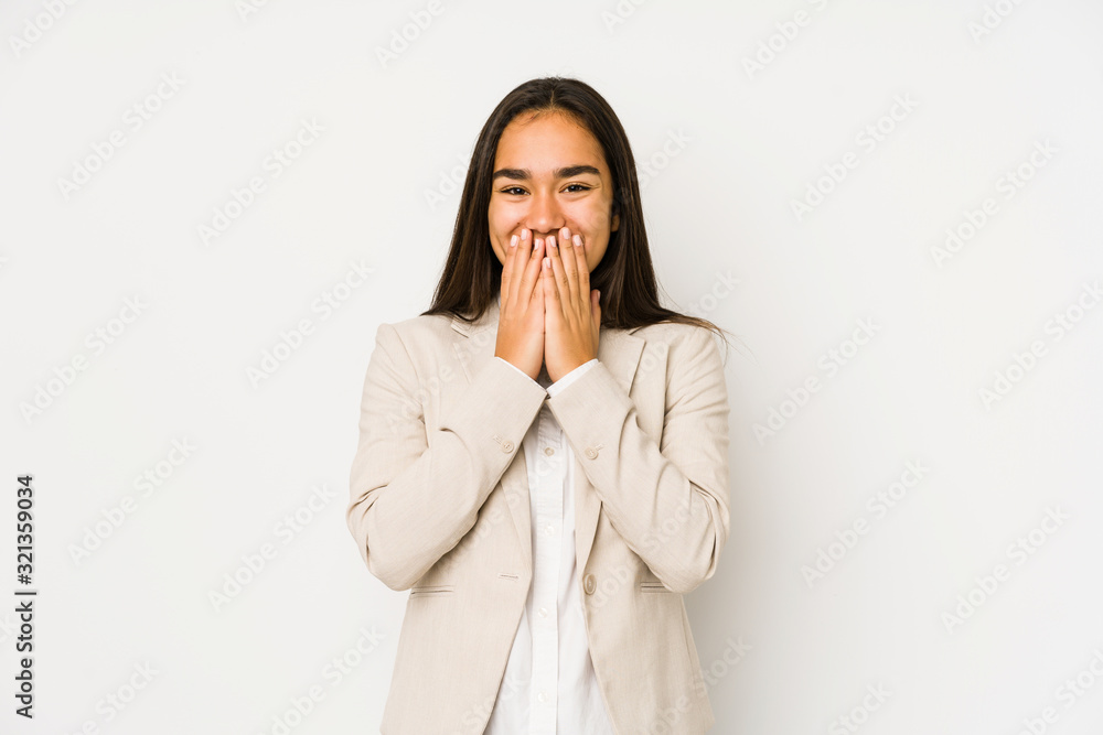 Young woman isolated on a white background laughing about something, covering mouth with hands. Young woman isolated on a white background laughing about something, covering mouth with hands.