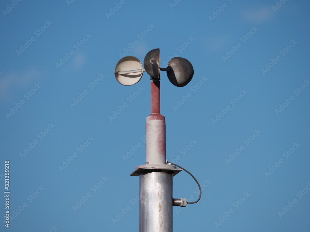 Tokyo,Japan-February 5, 2020: Anemometer or air speedometer on blue sky background Tokyo,Japan-February 5, 2020: Anemometer or air speedometer on blue sky background