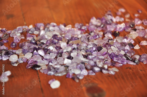 Amethyst on wooden background, purple crystals