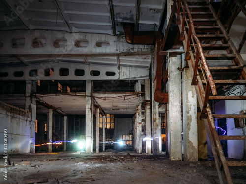 Old abandoned and ruined industrial building interior