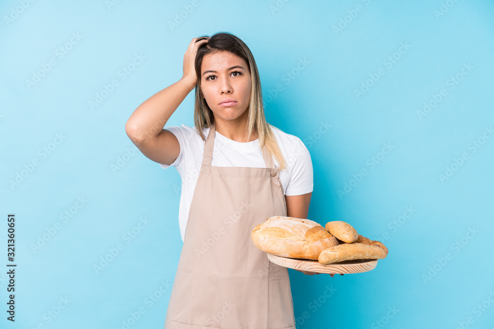 Young caucasian baker woman isolated being shocked, she has remembered important meeting. Young caucasian baker woman isolated being shocked, she has remembered important meeting.