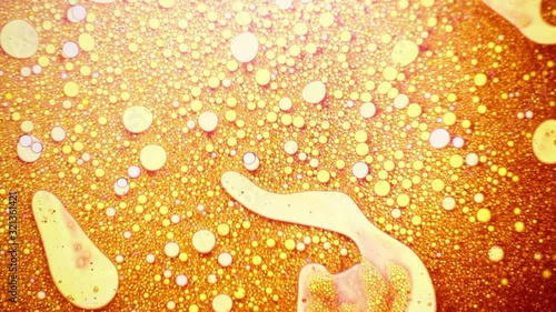 Interestic golden liquid pattern with bubbles photo