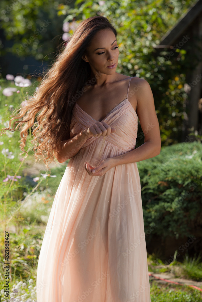 Portrait of beautiful young girl in summer garden. Portrait of beautiful young girl in summer garden.