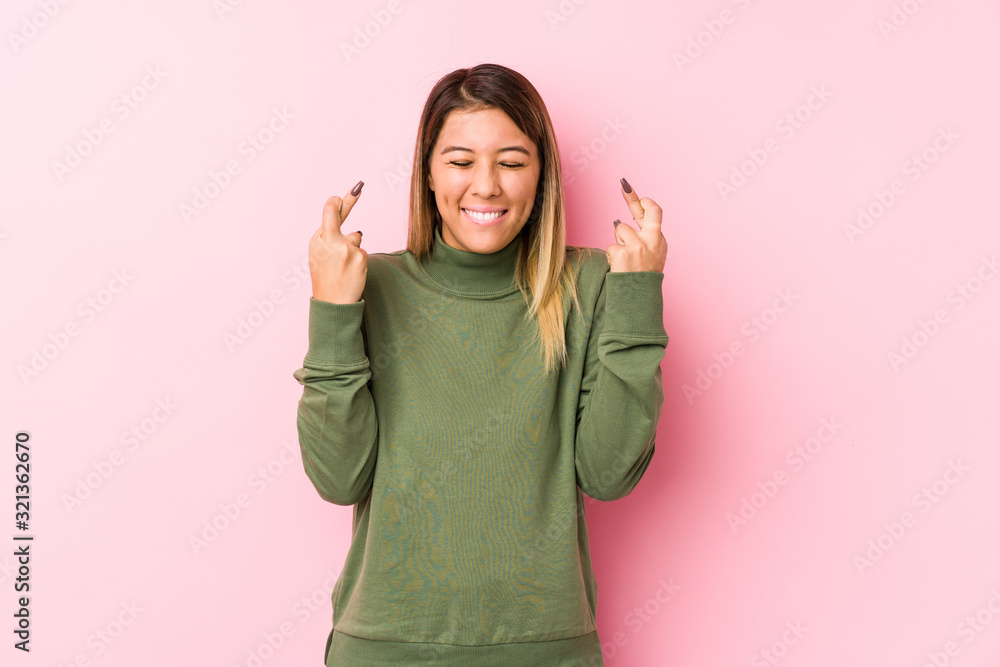 Young caucasian woman posing isolated crossing fingers for having luck Young caucasian woman posing isolated crossing fingers for having luck
