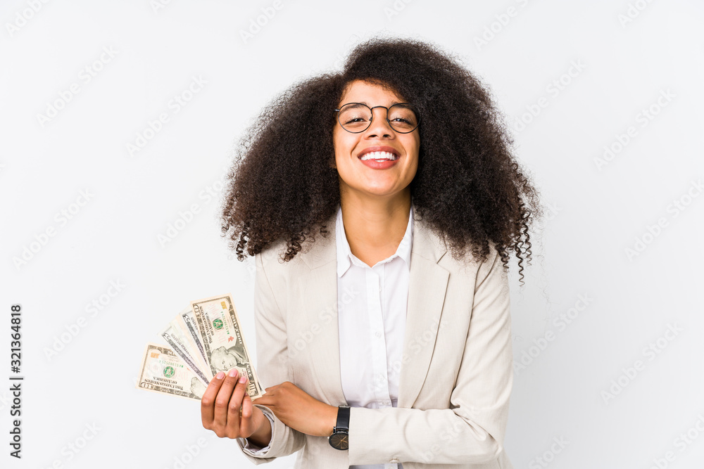 Young afro business woman holding a credit car isolated Young afro business woman holding a credit carlaughing and having fun. Young afro business woman holding a credit car isolated Young afro business woman holding a credit carlaughing and having fun.