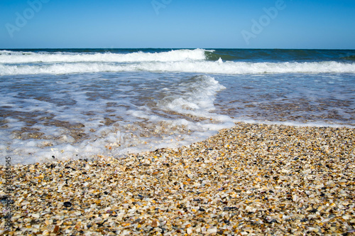 Ocean rolling over sea shells