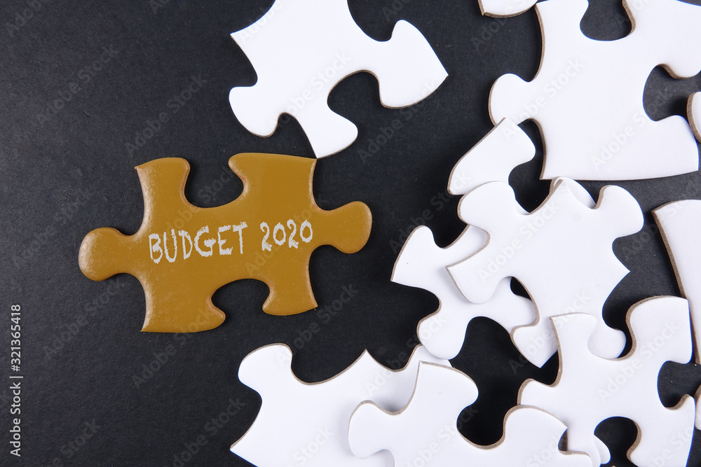 Budget 2020 printed on gold puzzle over white puzzle background Budget 2020 printed on gold puzzle over white puzzle background