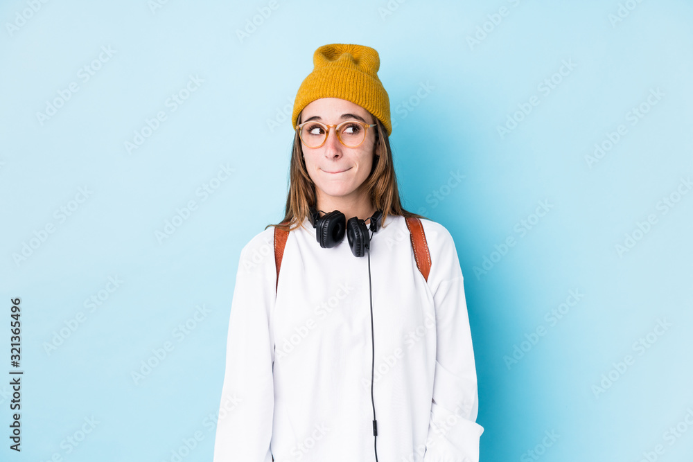 Young student woman isolated confused, feels doubtful and unsure. Young student woman isolated confused, feels doubtful and unsure.