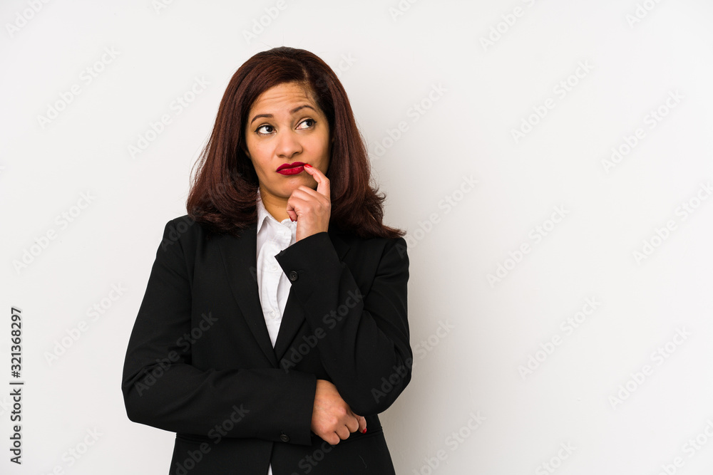Middle age latin business woman isolated looking sideways with doubtful and skeptical expression. Middle age latin business woman isolated looking sideways with doubtful and skeptical expression.