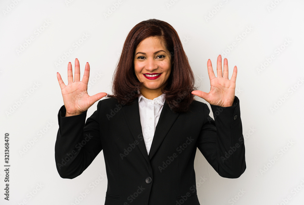 Middle age latin business woman isolated showing number ten with hands.
