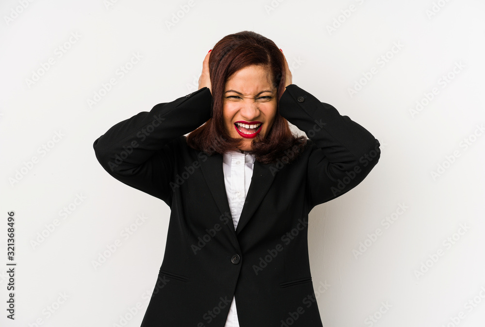 Middle age latin business woman isolated covering ears with hands trying not to hear too loud sound. Middle age latin business woman isolated covering ears with hands trying not to hear too loud sound.