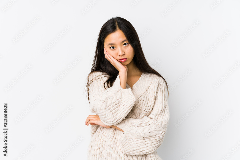 Young chinese woman isolated who is bored, fatigued and need a relax day. Young chinese woman isolated who is bored, fatigued and need a relax day.