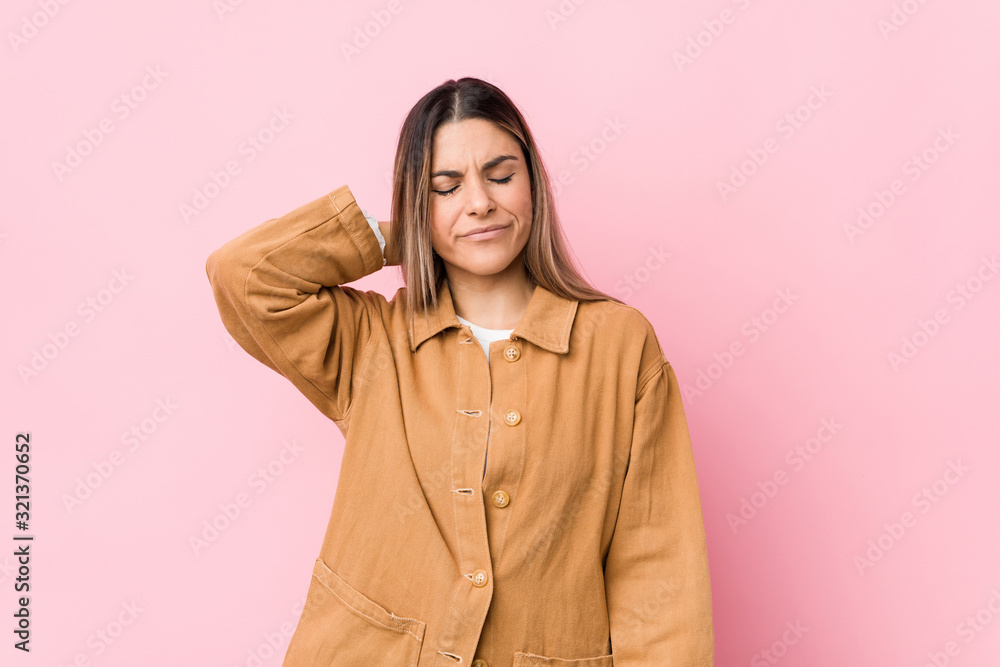 Fototapeta premium Young caucasian woman isolated suffering neck pain due to sedentary lifestyle.