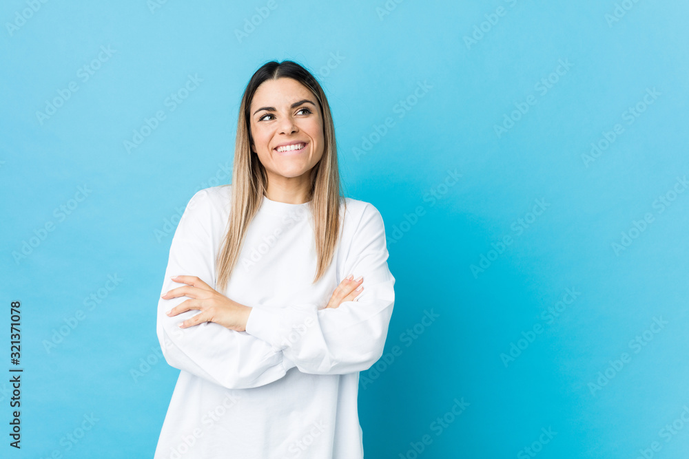 Young caucasian woman isolated smiling confident with crossed arms. Young caucasian woman isolated smiling confident with crossed arms.