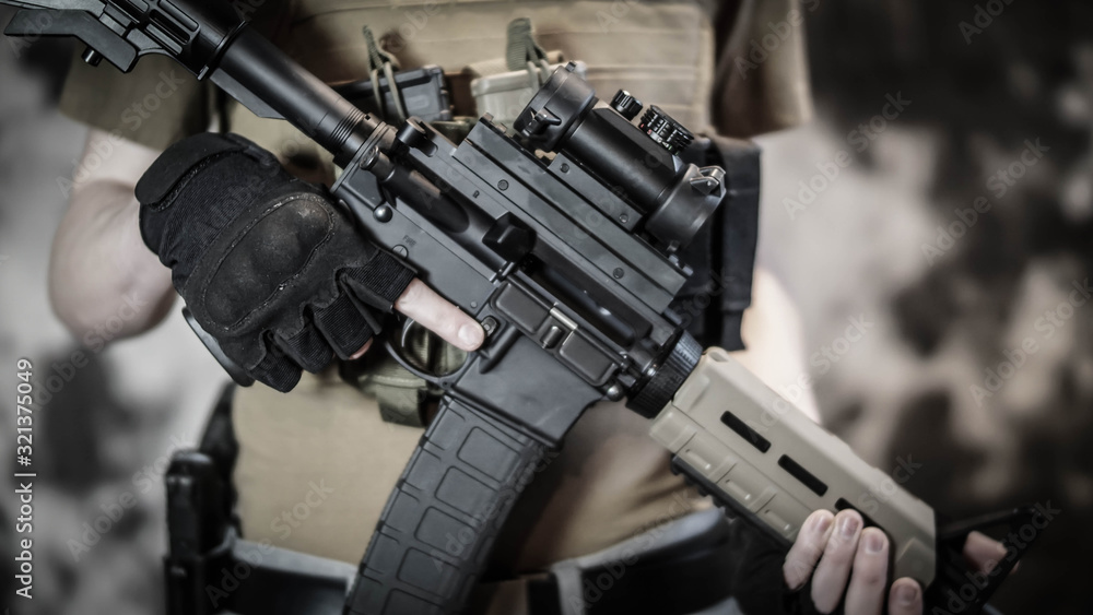 Armed Security contractor holding AR15 Rifle Armed Security contractor holding AR15 Rifle
