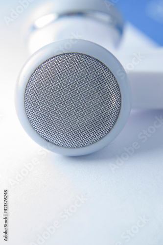 White earphone with white background © adityajati