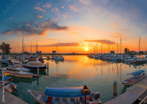 Boats and marina with beautiful sunset photo