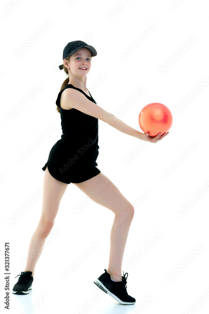 Girl gymnast performs exercises with the ball. Girl gymnast performs exercises with the ball.