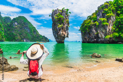 Stunning amazed nature scenic landscape with traveler woman on beach look joy James Bond island Famous landmark travel Phuket Thailand Tourism beautiful destination Asia Summer holidays vacation trips