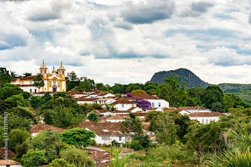 View of the old and famous city of Tiradentes in Minas Gerais with its houses, churches, mountains and vegetation