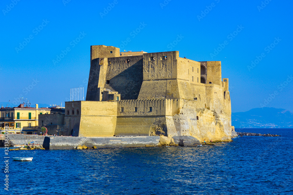 Naples, Italy - CIRCA 2013: Castel dell'Ovo (in English, Egg Castle) is a seaside castle in Naples, located on the former island of Megaride, now a peninsula, on the Gulf of Naples in Italy.