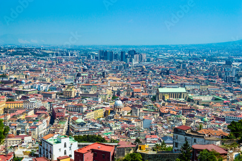 Fototapeta Naklejka Na Ścianę i Meble -  Aerial view of Naples' cityscape at a sunny summer day. The black builidngs in the far background is Napoli Centro Direzionale.