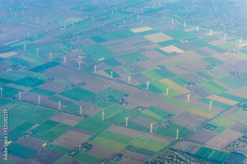 Photography Amsterdam Schiphol,, a large stadium with green grass windmill farm