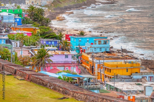 Colorful houses line the hillside over looking the beach in San Juan, Puerto Rico