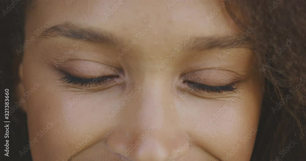 Close up portrait of a black woman's happy eyes looking into the camera, close up emotions Close up portrait of a black woman's happy eyes looking into the camera, close up emotions