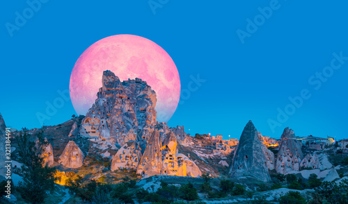 Pigeon Valley with Uchisar castle with full moon "Elements of this image furnished by NASA "