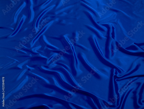 BLUE SILKY CLOTH WITH FOLDS BACKGROUND