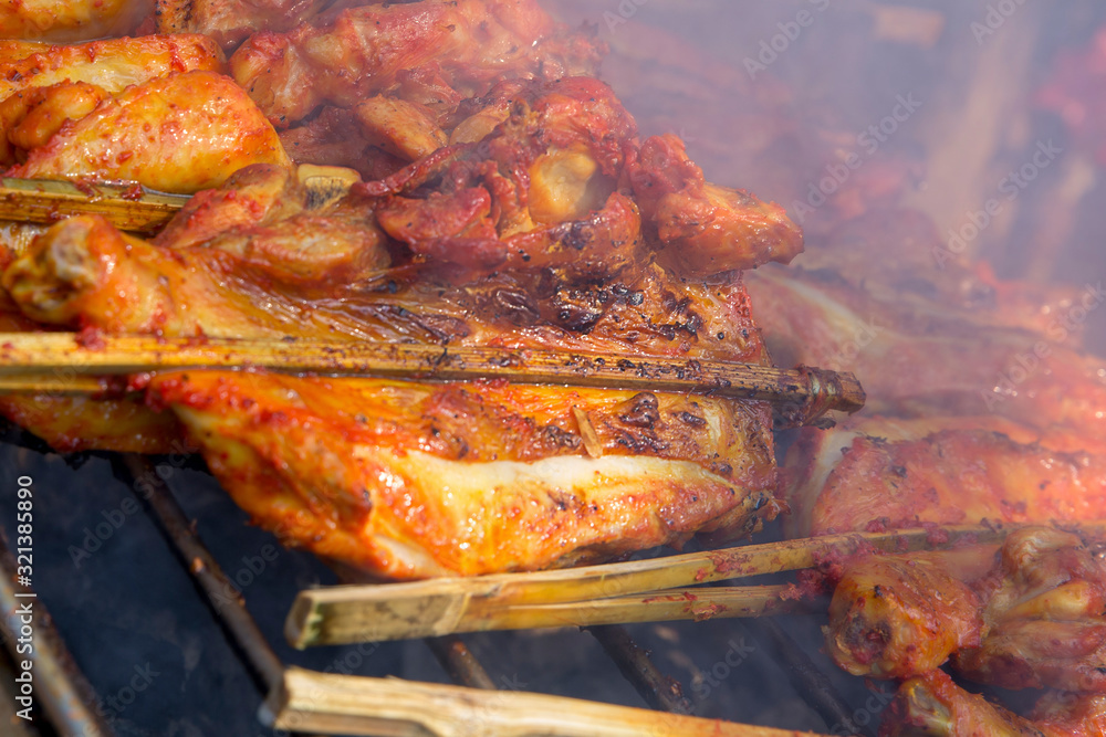 Close up of Roast or Grilled Chicken, Thai street food favorites.