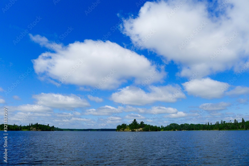 clouds over the lake at Pelican Pouch Lake, Ontario, Canada clouds over the lake at Pelican Pouch Lake, Ontario, Canada