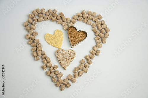 health heart made from pressed bran, rice briquette, ground bran on a white background