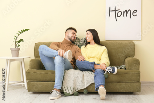 Young couple sitting on sof...