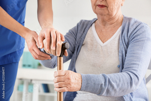 Female doctor with senior w...