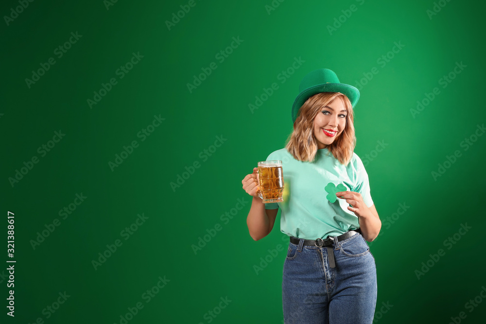 Young woman with beer on color background. St. Patrick's Day celebration Young woman with beer on color background. St. Patrick's Day celebration