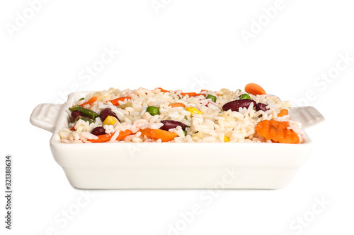 Boiled rice with vegetables in dish on white background