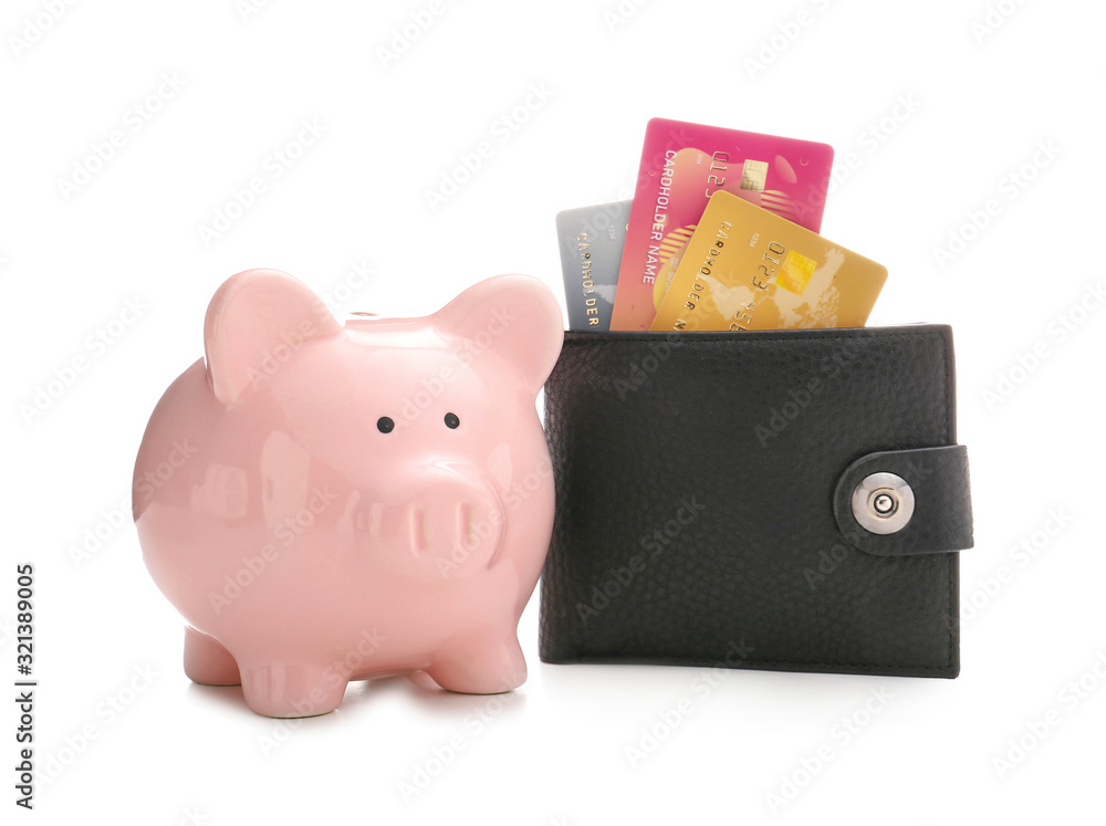 Credit cards with wallet and piggy bank on white background. Concept of ...
