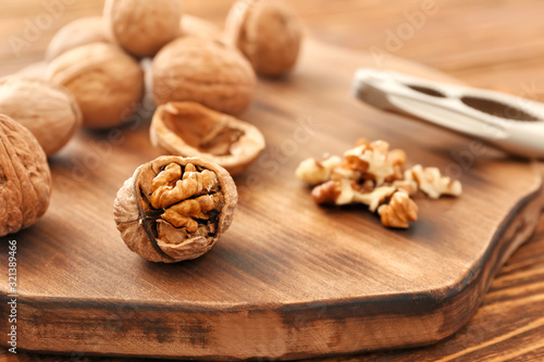 Tasty walnuts on wooden board