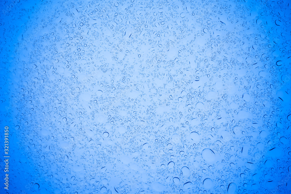 Rain droplets on blue glass background, Water drops on blue glass. Rain droplets on blue glass background, Water drops on blue glass.