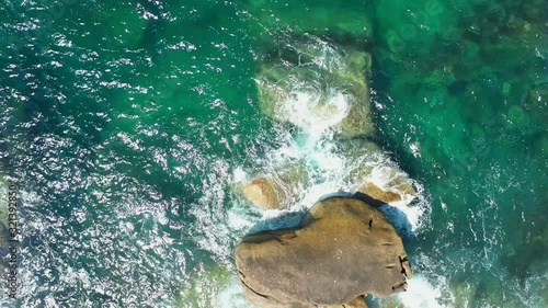 Footage B-roll of Aerial view drone shot ocean waves, Beautiful tropical beach and rocky coastline and beautiful forest. Nga Khin Nyo Gyee Island Myanmar. Tropical seas and islands in southern Myanmar photo