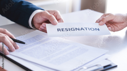 Employee businessman submit or sending resignation document letter to human resource manager or boss, Change of job, unemployment, resign concept.