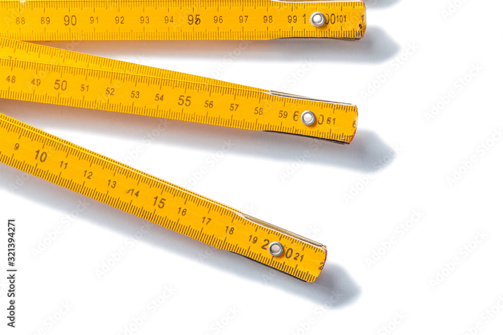 very close up view yellow wooden meter isolated on white