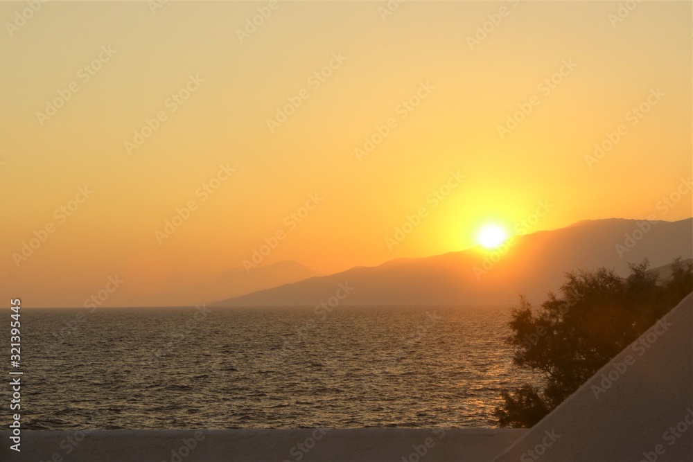 golden sunset over the Aegean Sea, Greece holiday, vacation home, copy space