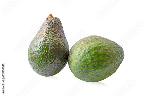 Two round green avocado fruits die cut on white background, isolated with clipping path