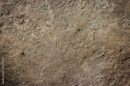 Soil brown ground surface top view texture and background.