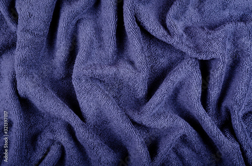 Blue towel fabric texture, top view photo.